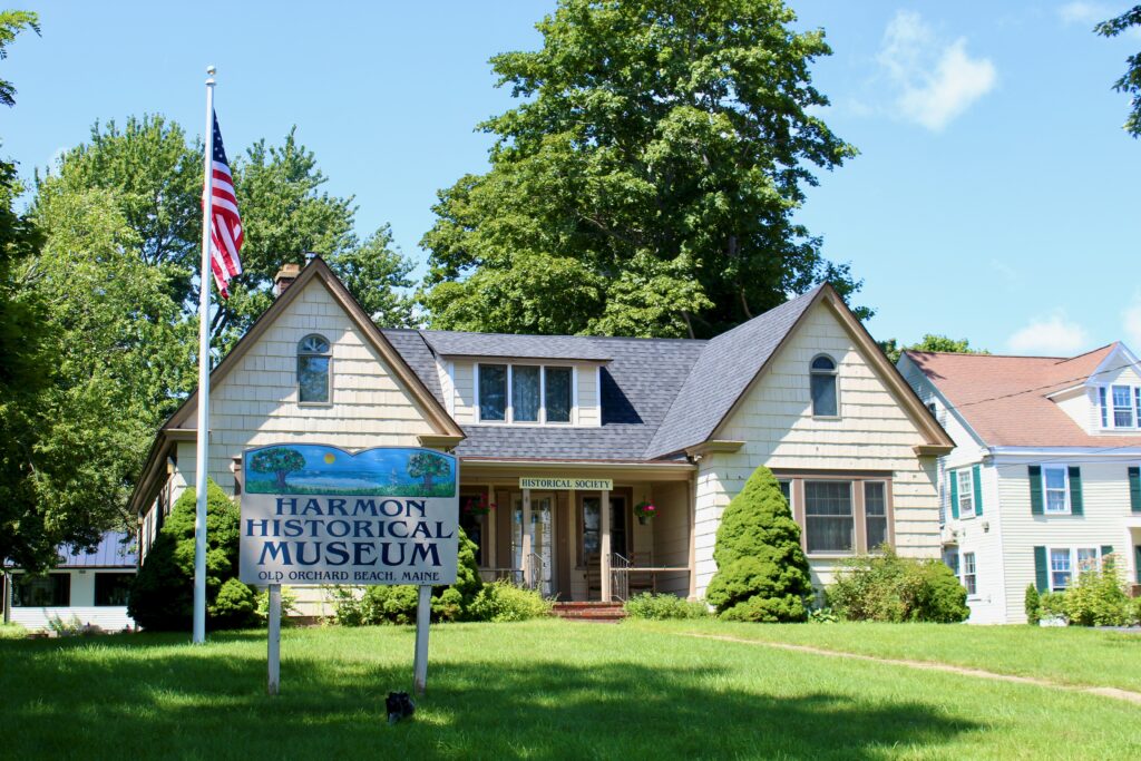 The OOB Historical Society/Harmon Memorial Museum building with green grass and a walking path to the entrance.